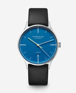 popup|Ultra-flat and understated|Inspired by the Bauhaus movement, the dial is reduced and kept clear. Fine details, such as the concave curvature, nevertheless give the model an independent character.